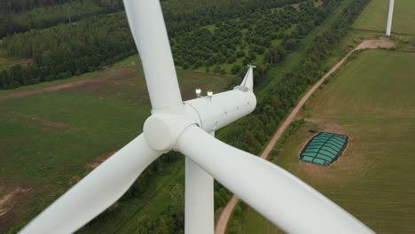 Aerial-close-up-view-of-a-rotating-wind-turbine-blades