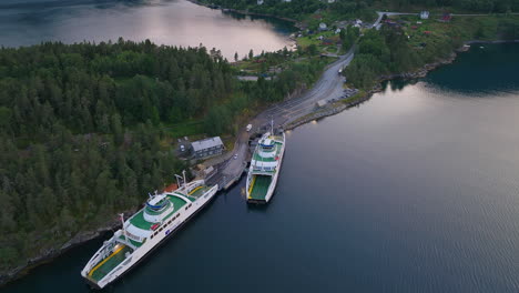 vehicles drive onto ferry at dragsvik fergeleie, balestrand, sognefjord aerial