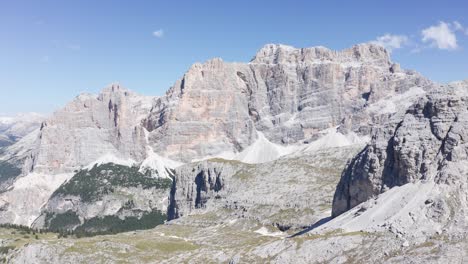 Aerial-view-of-Fanes-Nature-Park-with-rocky-mountains-bathed-in-sunlight