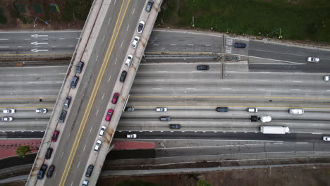 Top-Down-Aerial-View,-US-101-Highway,-Santa-Ana-Freeway-Traffic-in-Los-Angeles-CA-USA,-North-Hill-Bridge-and-Vehicles,-High-Angle-Drone-Shot