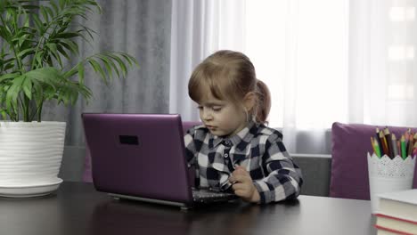 Girl-studying-online-homework-using-digital-laptop-computer.-Distance-education