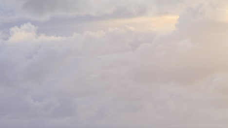 timelapse of clouds with blue, grey, white, yellow colours