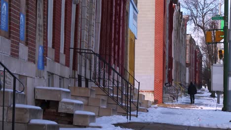 people walk on the streets in a north baltimore slum