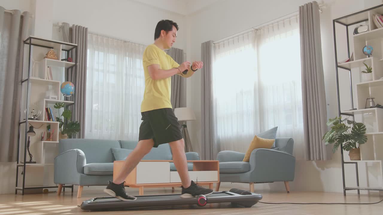 Man Walking on a Treadmill at Home