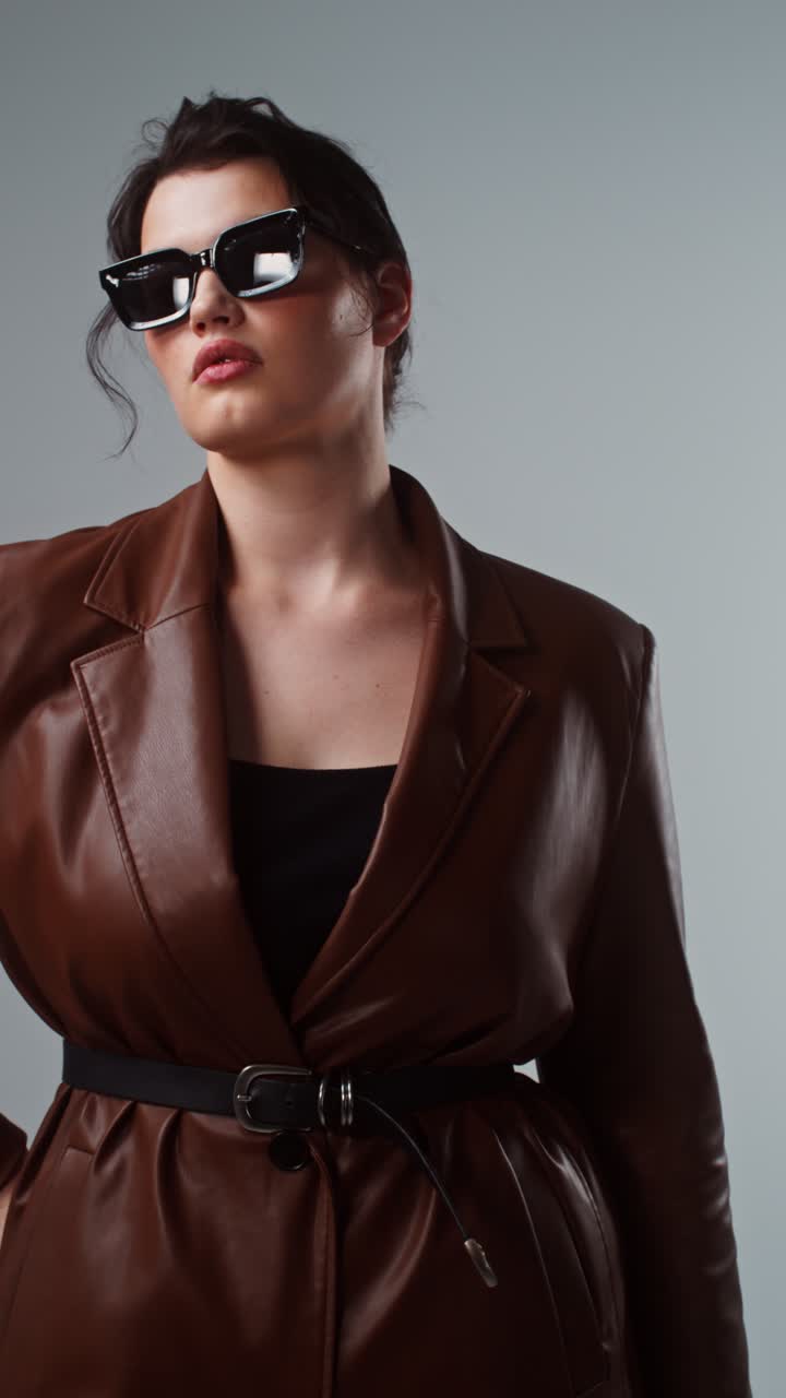 Woman in Brown Leather Trench Coat and Sunglasses