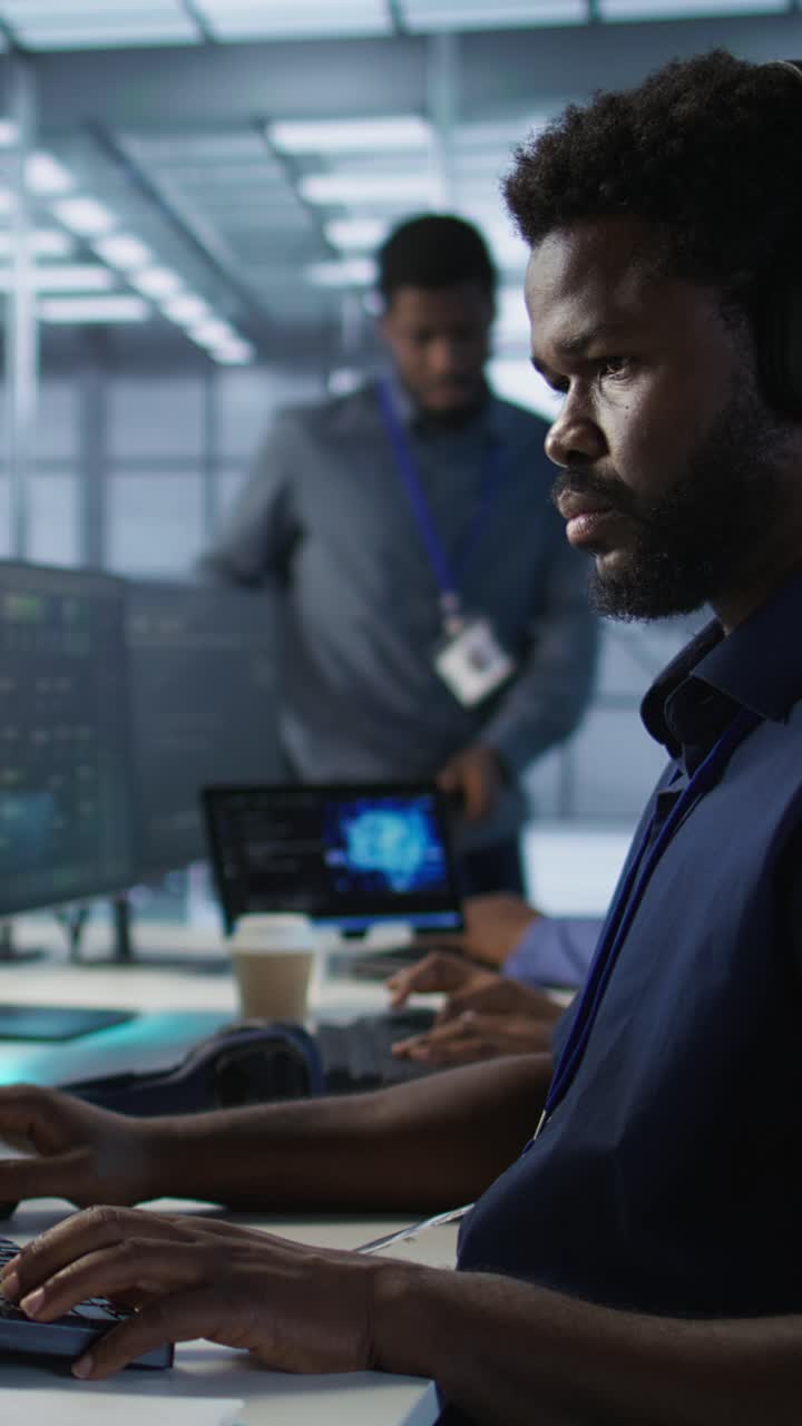 Vertical video Engineer using audio device to hear podcasts in data center