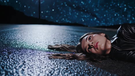 a woman lying on the road at night under the stars