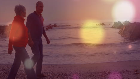 walking on beach, couple with light bokeh animation over ocean waves