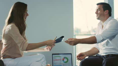 happy professionals shaking hands after agreement