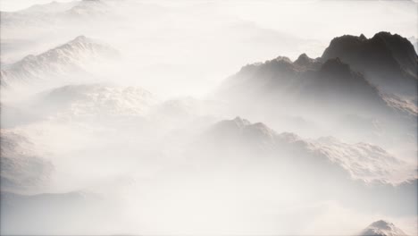 distant mountain range and thin layer of fog on the valleys