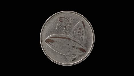ghana 2007 20 pesewas coin reverse with cocoa pod and denomination rotating on black background