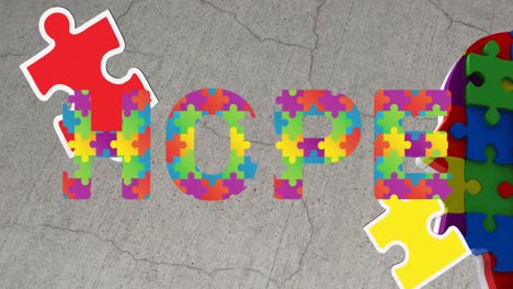 animation of hope text over head with puzzle pieces on grey background