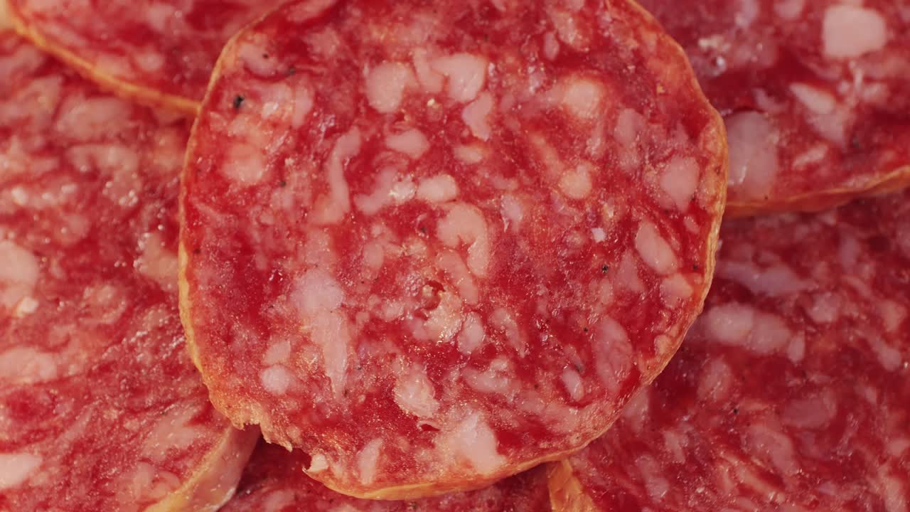 Mix of spanish pork sausages, Cutting board of appetizing catalonian snack - fuet, jamon, chorizo, olives, supermarket tapas food in spain, traditional cuisine.