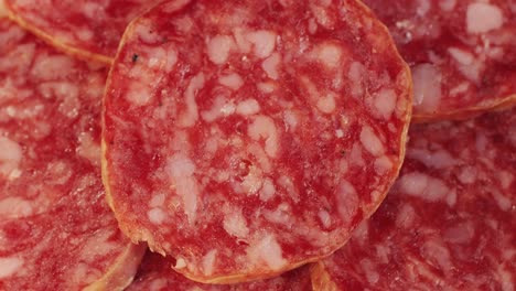 mix of spanish pork sausages, cutting board of appetizing catalonian snack - fuet, jamon, chorizo, olives, supermarket tapas food in spain, traditional cuisine.