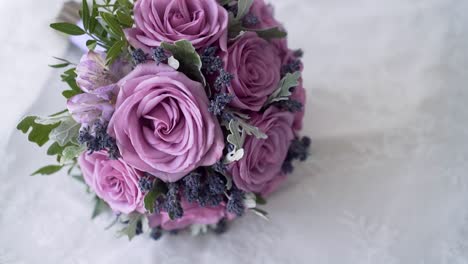 slow-motion-purple-rose-bouquet-with-green-and-pink-elements