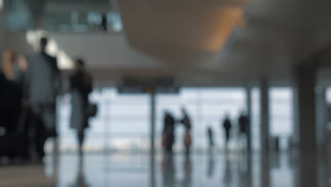 airport terminal with walking people defocus