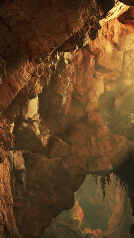 dark and mysterious cave entrance with sunlight shining through