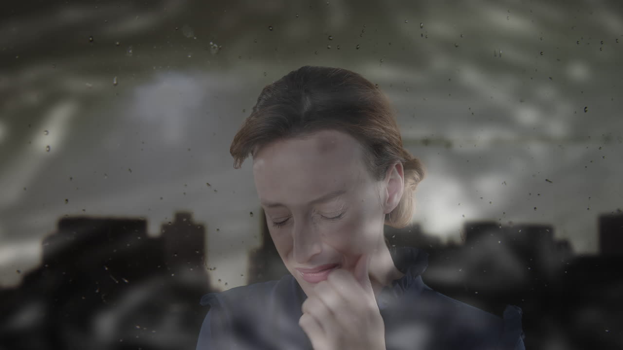 Animation of cityscape over sad caucasian woman touching her cheek