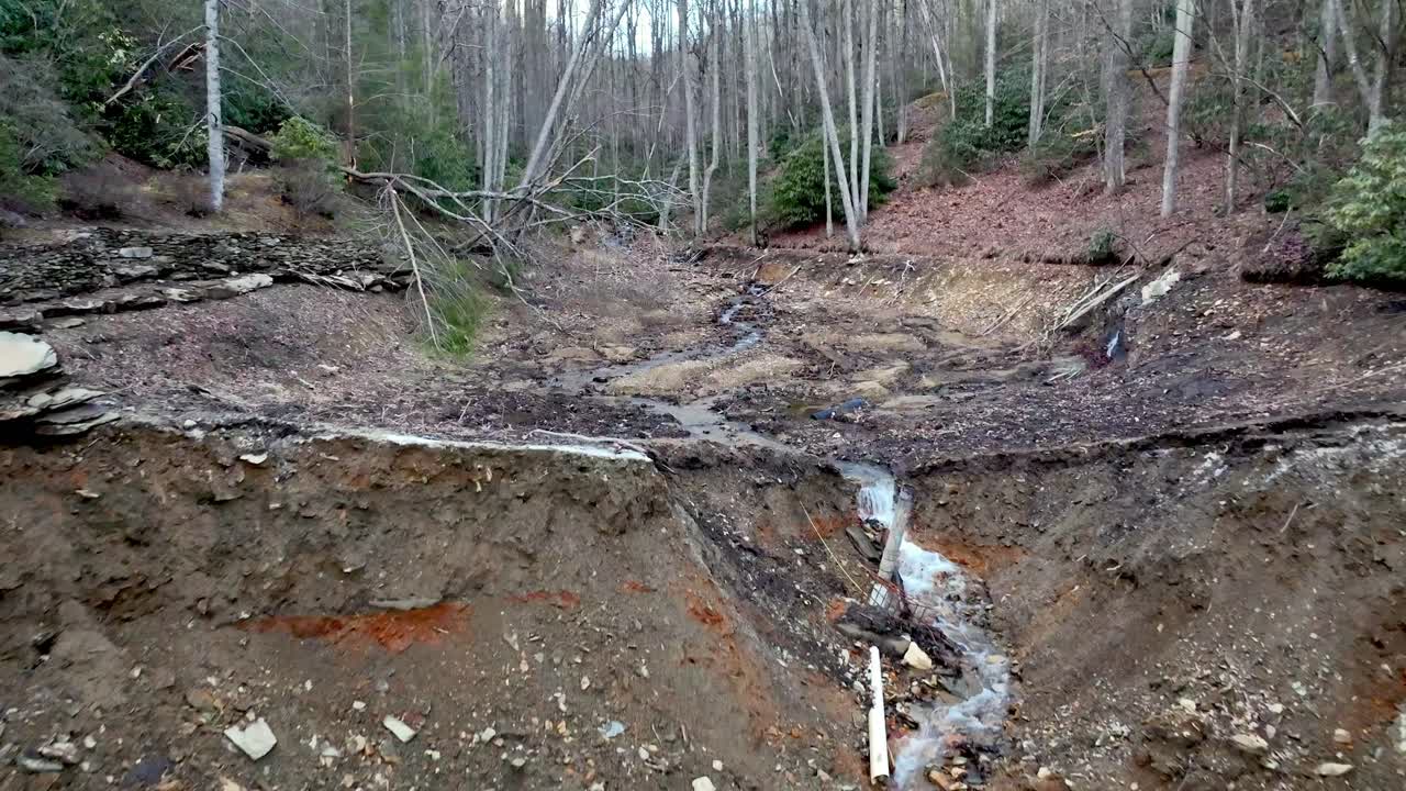 dam break during hurricane helene on an earthen dam near boone nc, north carolina