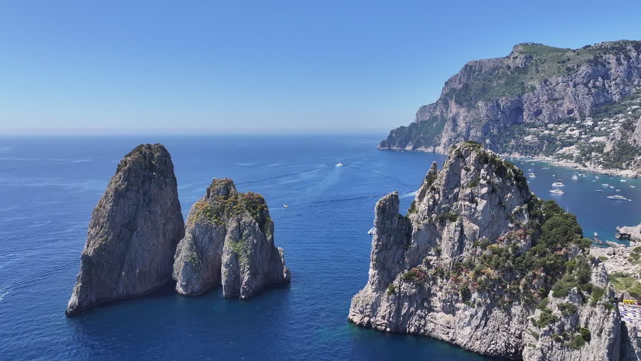 Faraglioni Island At Capri In Naples Italy. Beach Landscape. Giant Cliffs Scene. Faraglioni Island At Capri In Naples Italy. Gulf Of Naples Skyline. Mediterranean Sea Coast. Scenic Capri Island.