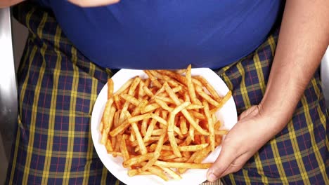 person eating fries