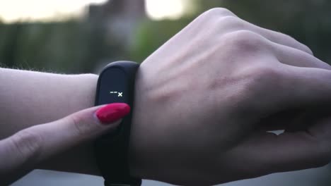 woman using fitness tracker