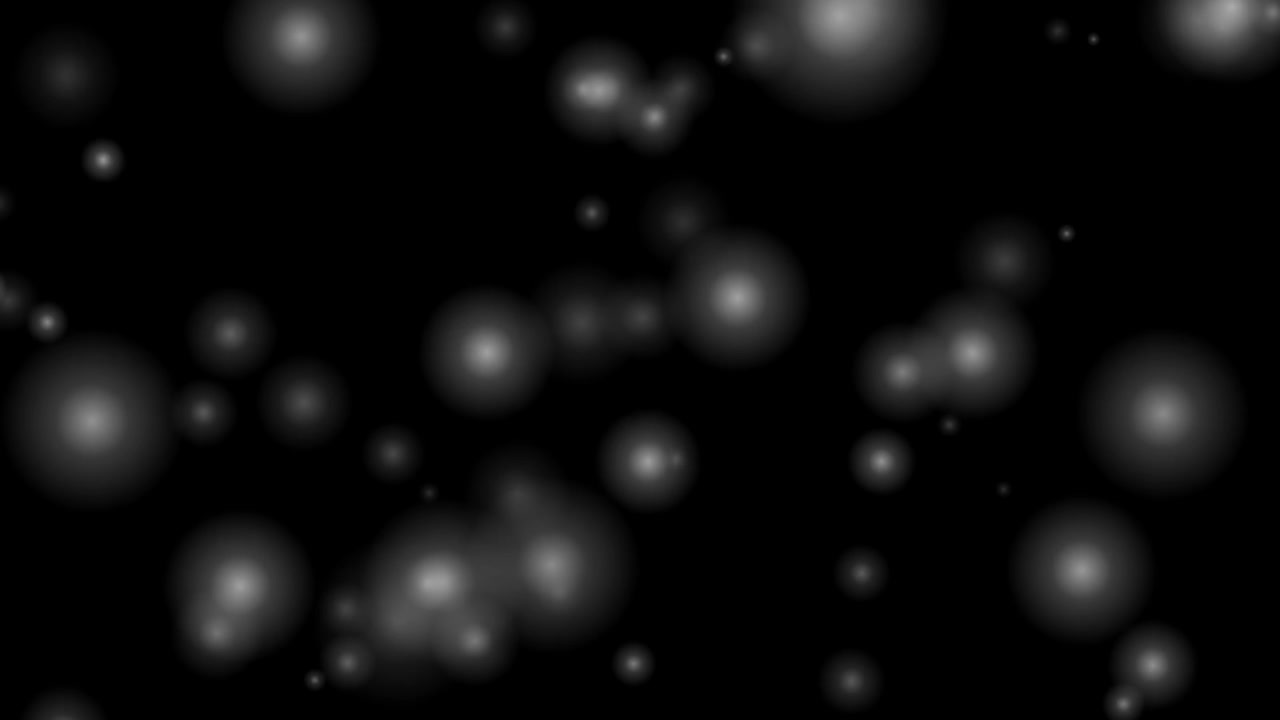 Floating White Glowing Particles on Black Background