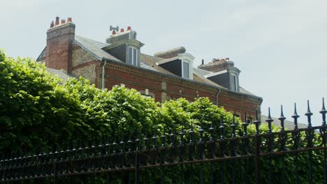 old european town house with lush garden