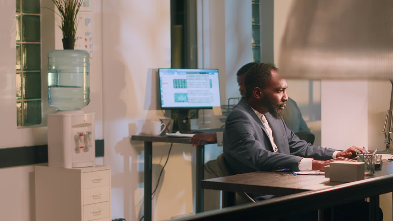 Images of a Man Working in an Office