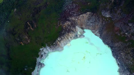 Top-View-Of-The-Famous-Kawah-Putih-Or-White-Crater-In-Bandung,-West-Java,-Indonesia---aerial-drone-shot