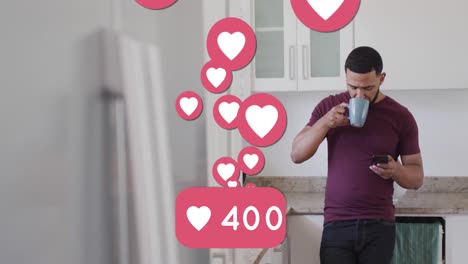 Animation-of-numbers-and-social-media-heart-icons-over-biracial-man-using-smartphone