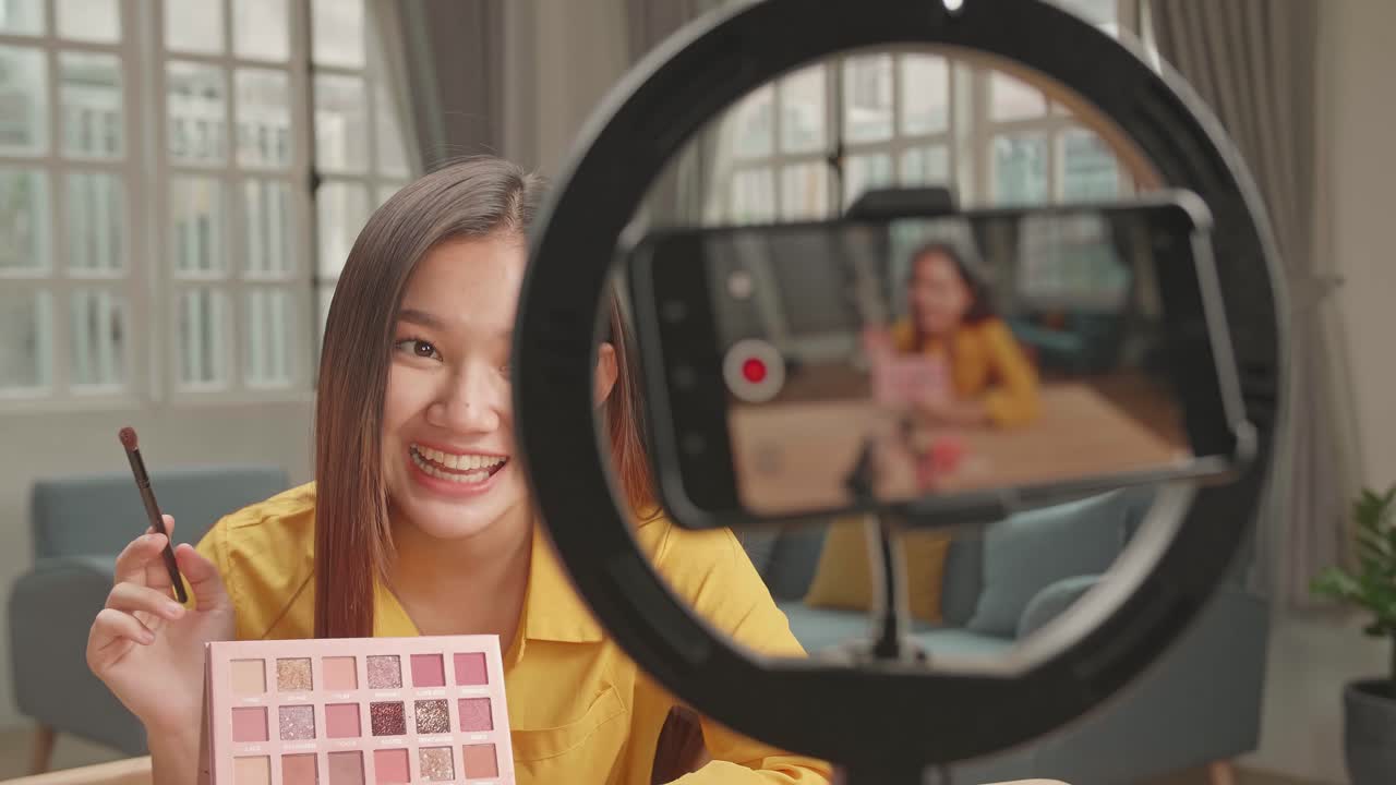 Asia Beauty Blogger Woman With Make-Up At Home Studio, Recording Video On Smartphone