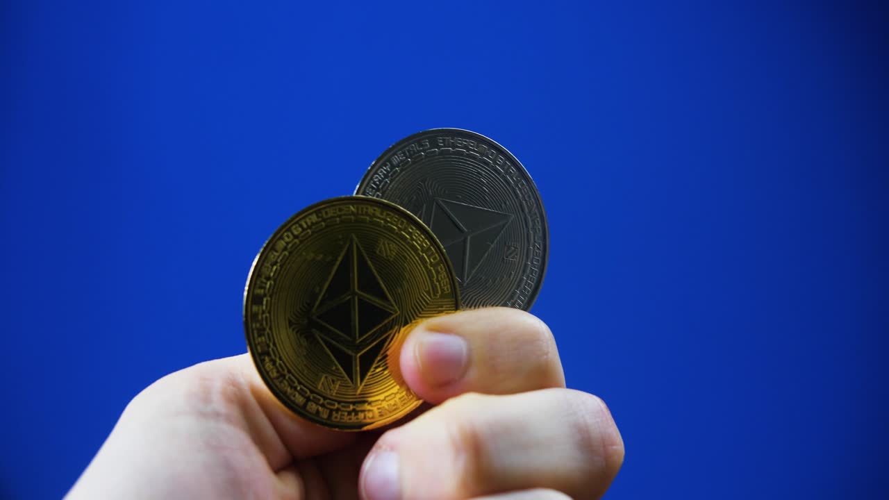 Hands holding precious Bitcoin and ethereum coins. Close up