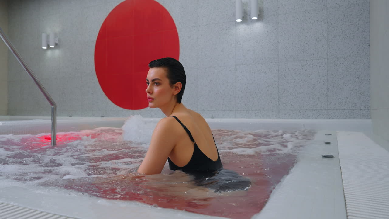 Woman Relaxing in a Modern Hot Tub