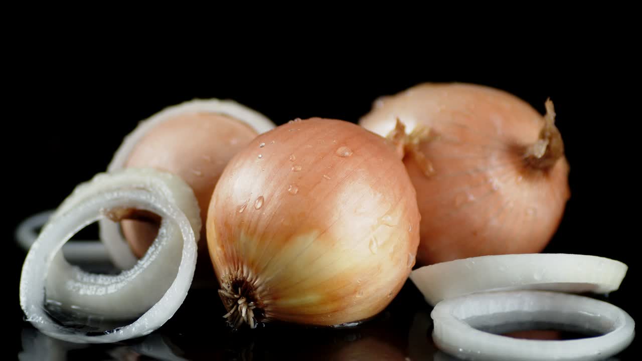 Fresh onion lies on the water.
