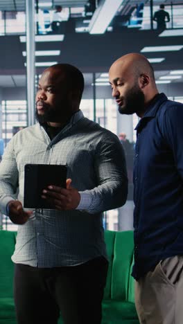 vertical video diverse group of ceos applying data analysis and strategic thinking