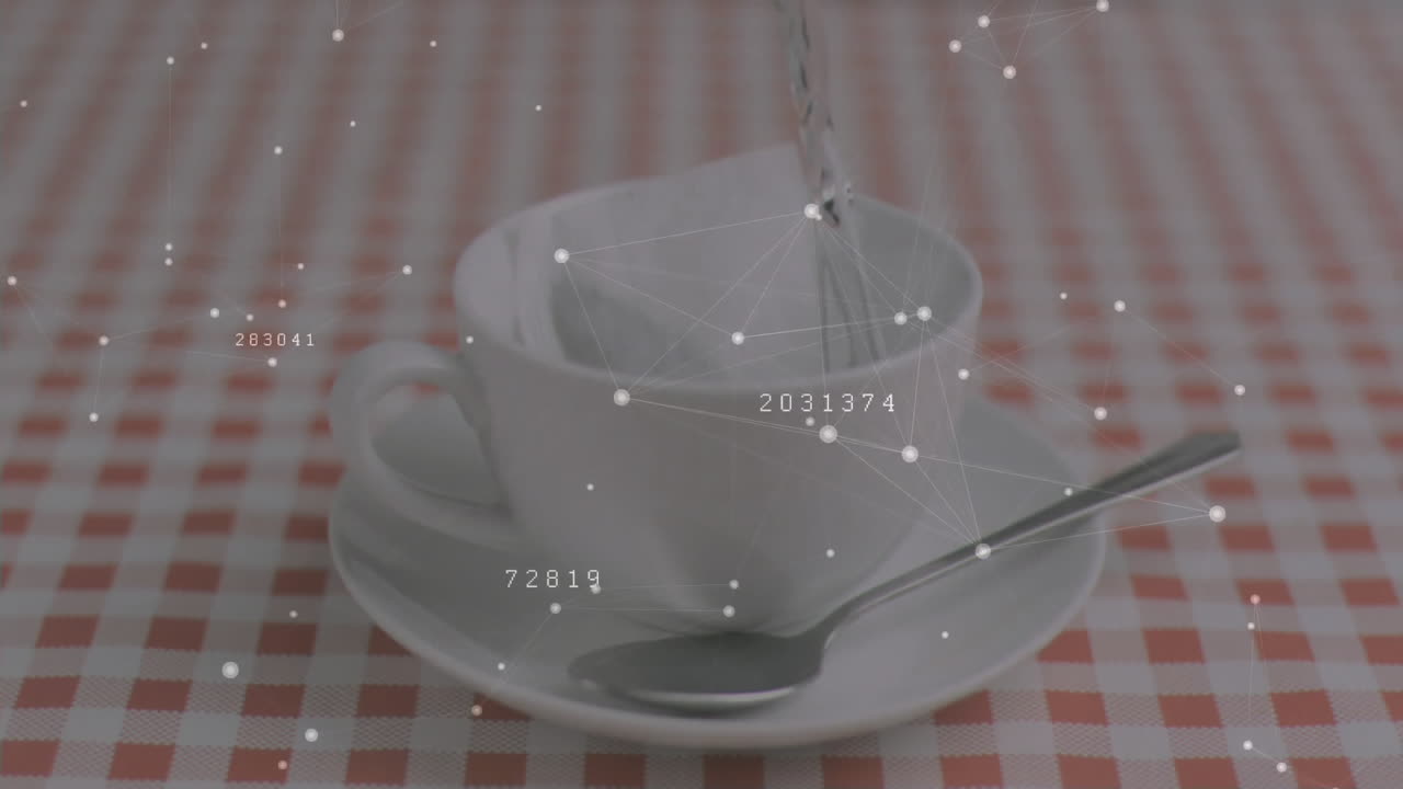 Liquid pouring into ceramic cup on saucer over checkered cloth, network overlay mapping data nodes