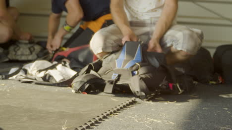 folding a parachute into a backpack