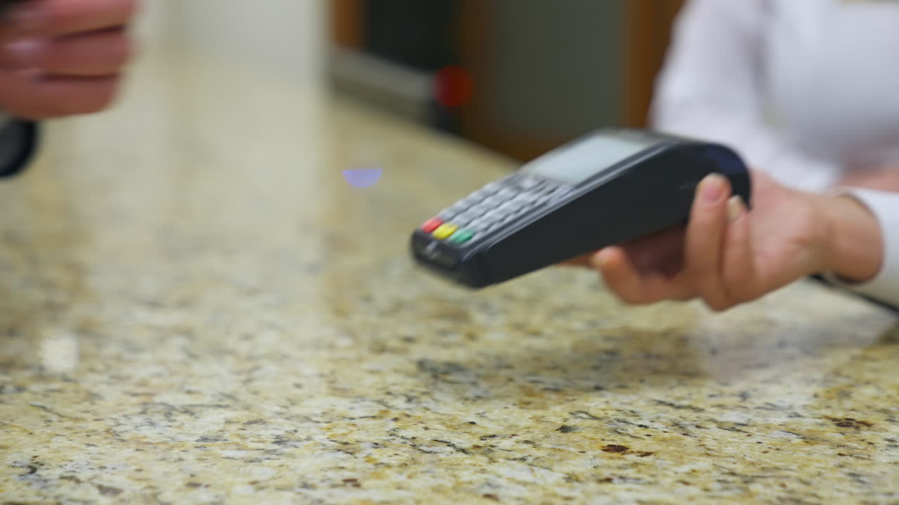 Traveler at hotel reception. Customer paying for services in hotel