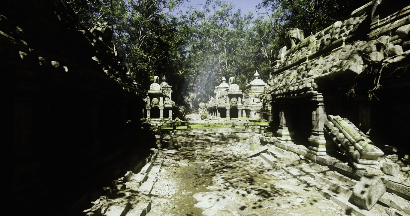 Calm waters mirror detailed stone sculptures next to lush trees