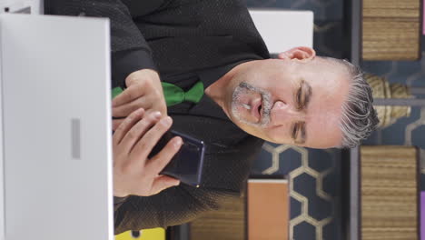 vertical video of businessman liking mobile application from phone.