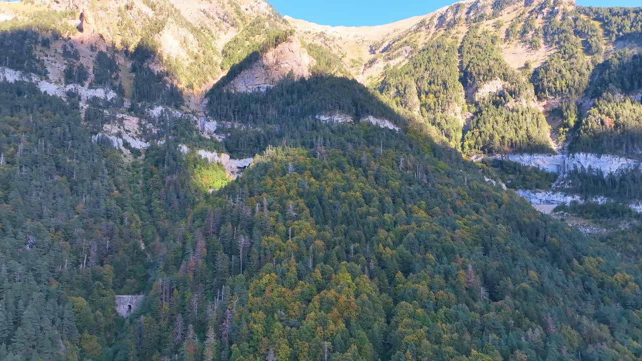 Aerial traverses rich forested alpine flanks and ravines, Spain's famed Canfranc