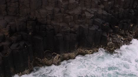 waves impact basalt columns over twelve seconds