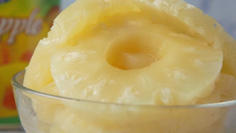 canned pineapple rings in a glass bowl