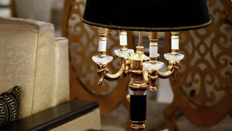 close up view of stylish four light lamp with shade hood