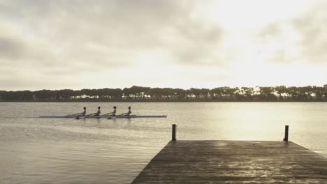 female rowing team training on a river