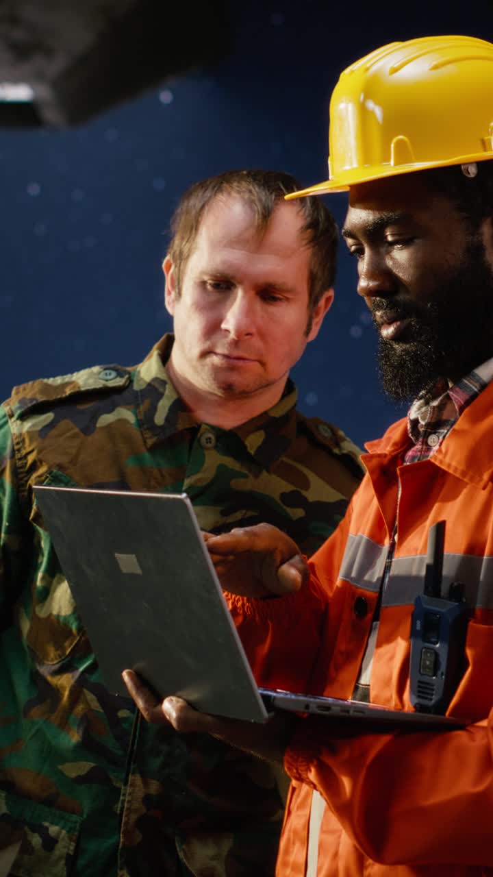 Vertical Video Naval soldier communicates via radio during offshore drilling operation