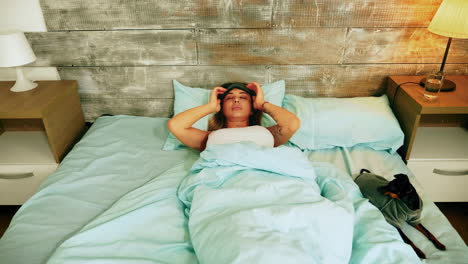 Attractive-young-woman-in-pajamas-waking-up