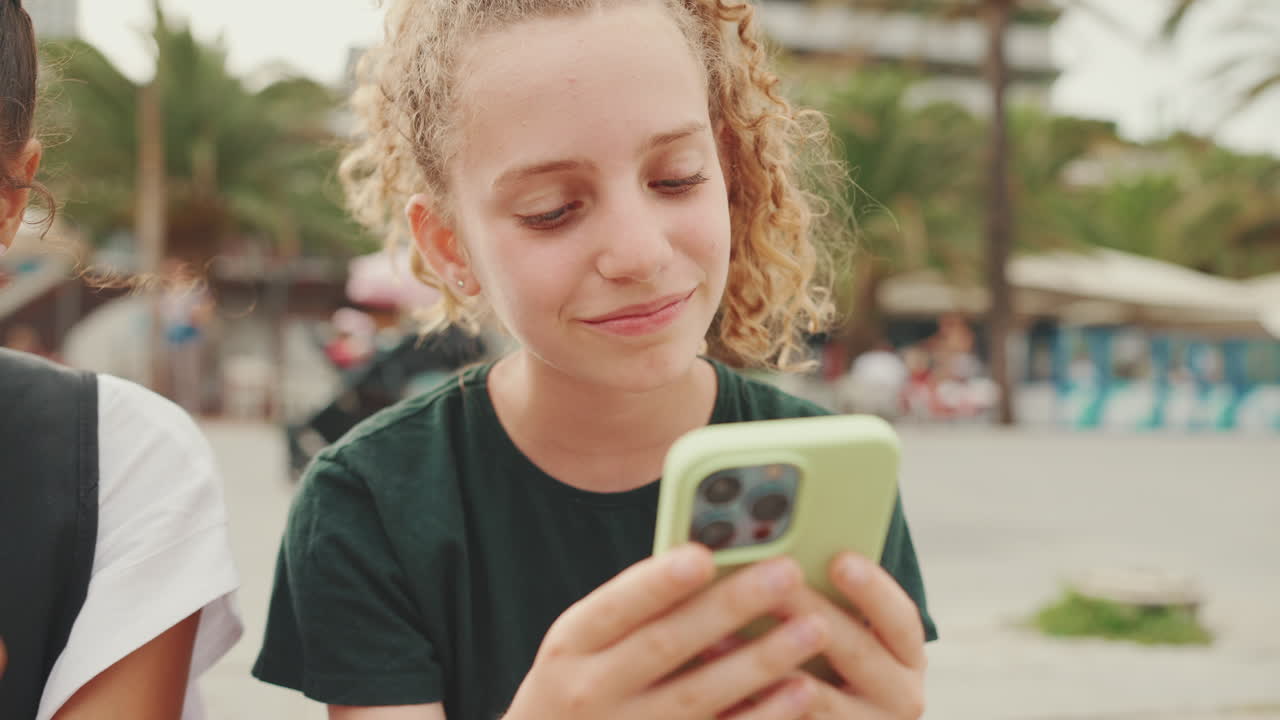 Girl using smartphone outdoors
