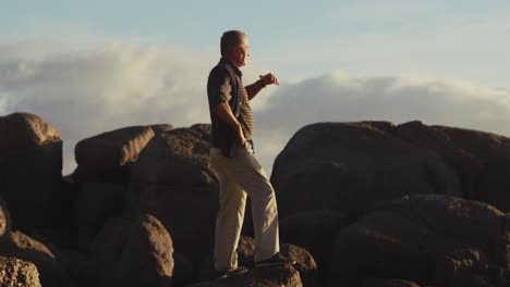 senior man looking away at the beach